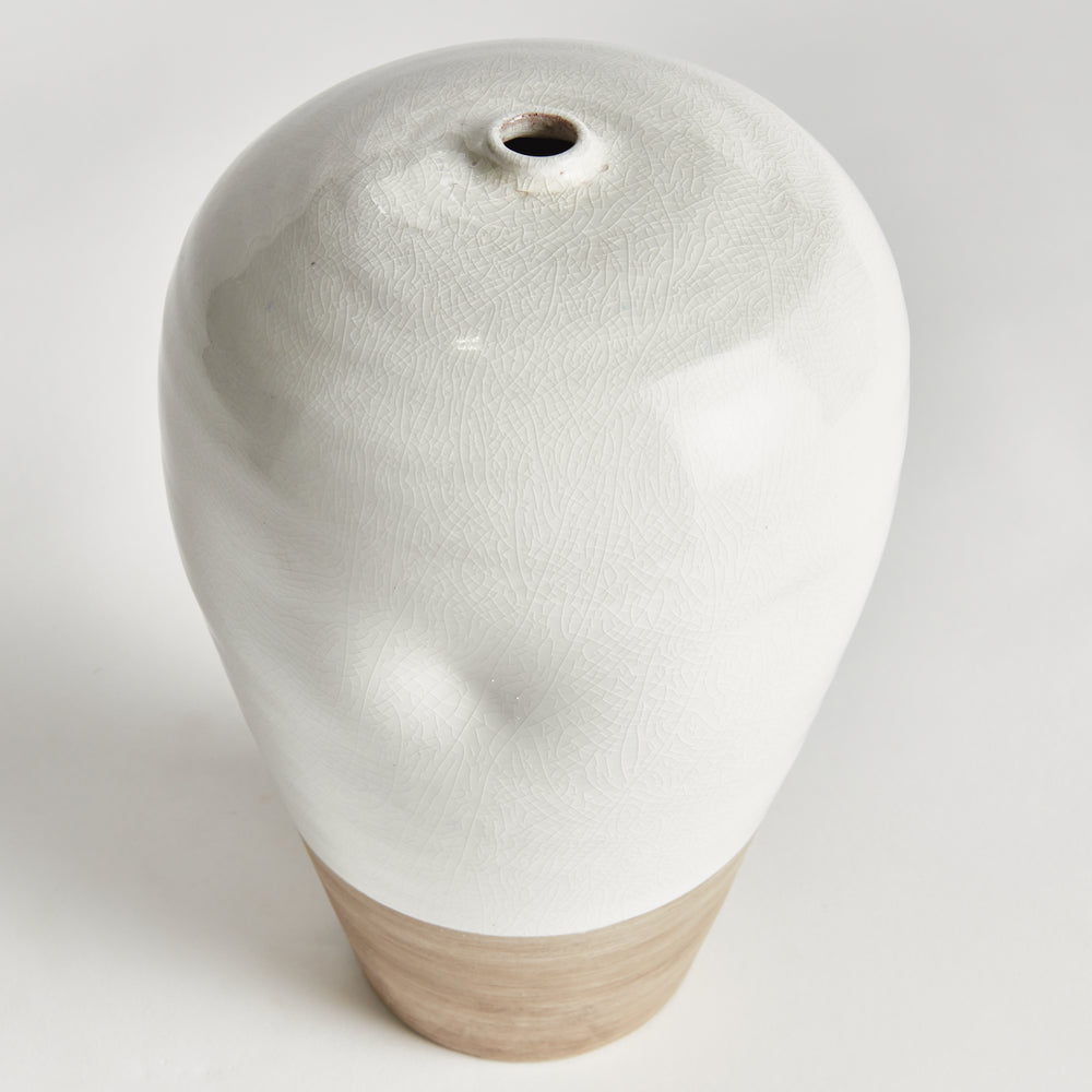 Angle of Alba large vase showing the narrow opening and glossy white reactive glaze above a natural clay base. Modern Organic