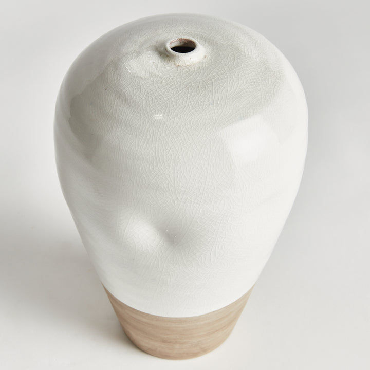 Angle of Alba large vase showing the narrow opening and glossy white reactive glaze above a natural clay base. Modern Organic