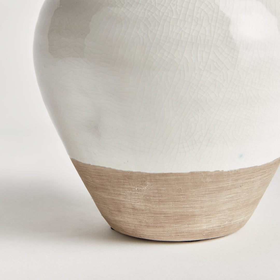 Detail of Alba small vase showing white glaze texture and the exposed natural clay base on a pale background. Modern Organic