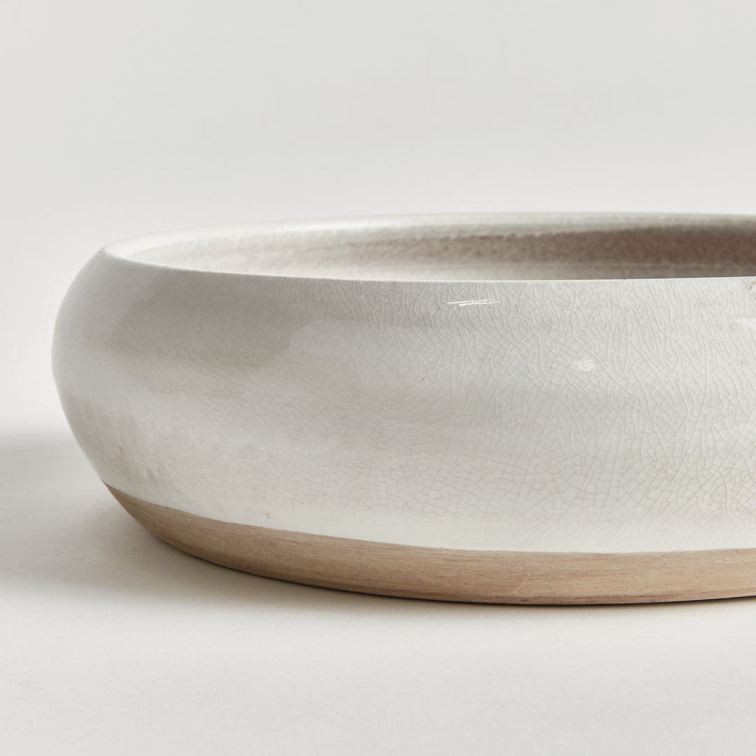Detail of Alba bowl showing glossy white reactive glaze, fine surface texture and exposed natural clay base. Modern Organic