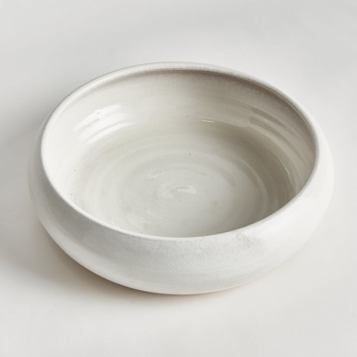 Top view of Alba white terracotta bowl showing an open interior, rounded rim and glossy reactive glaze coat. Modern Organic