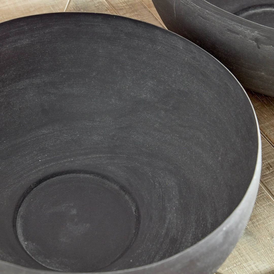 Interior detail of decorative metal bowl showing matte aged zinc texture and handcrafted character – Modern Organic style.