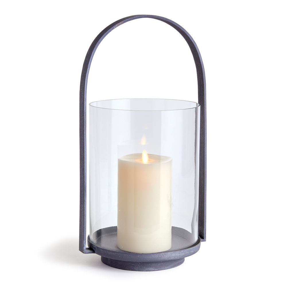 Large outdoor hurricane candle holder with aged zinc finish and clear glass cylinder for layered patio and porch styling – Transitional style.