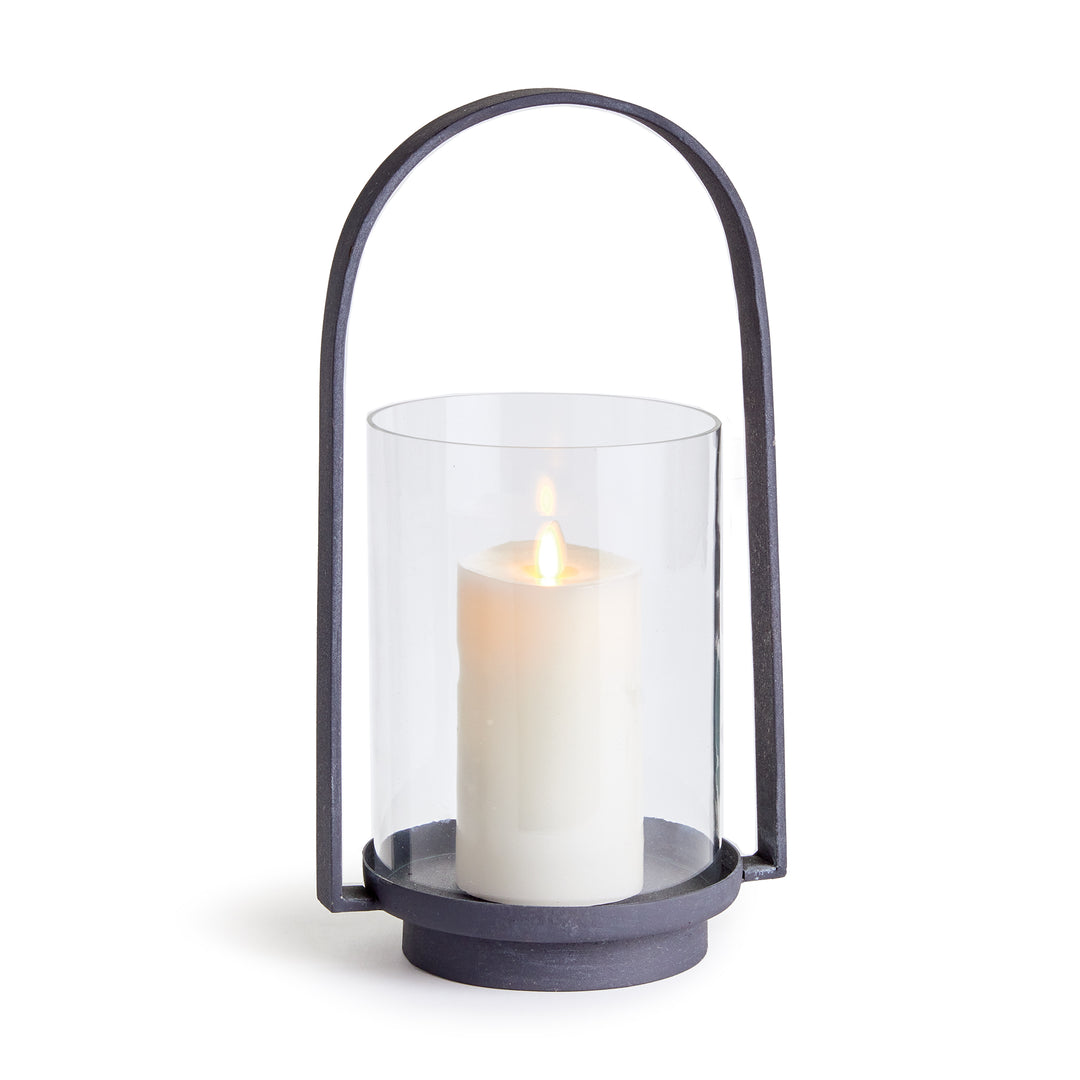 Outdoor hurricane candle holder with aged zinc finish, glass cylinder, and streamlined metal frame for patios and modern outdoor spaces – Modern Organic style.
