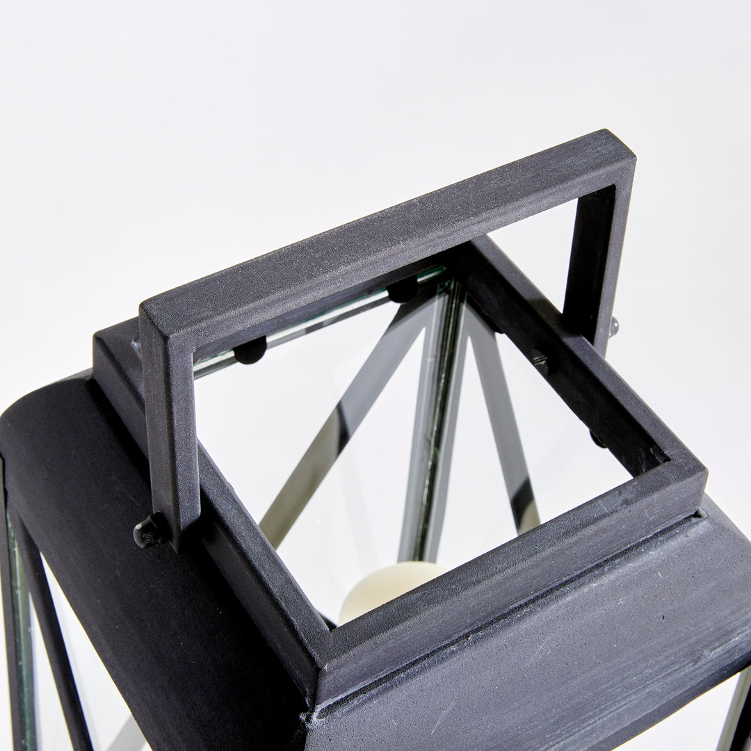 Close-up of outdoor metal lantern handle and aged zinc iron finish with architectural detailing – Transitional style.