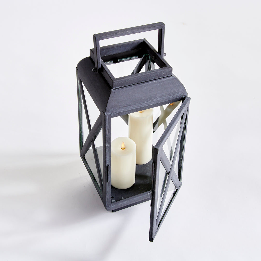 Outdoor metal lantern with hinged glass door and aged zinc finish for candlelit exterior styling – Industrial Outdoor style.