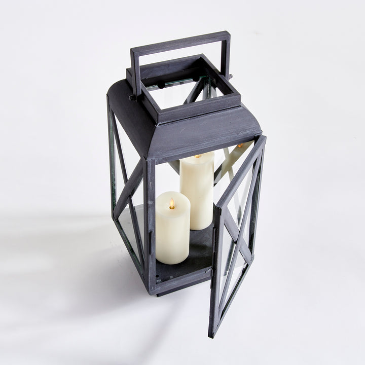 Outdoor metal lantern with hinged glass door and aged zinc finish for candlelit exterior styling – Industrial Outdoor style.