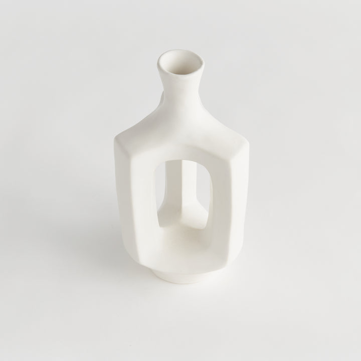 Medium matte white clay vase, angled view showing the hollow center, rounded shoulders and smooth matte glaze. Modern Organic