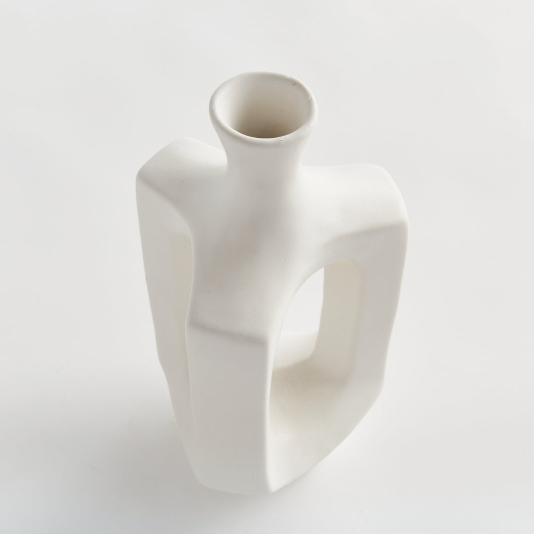 Medium matte white clay vase, close view of the circular mouth, narrow neck and rounded matte white shoulder. Modern Organic