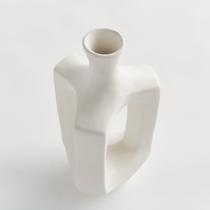 Medium matte white clay vase, close view of the circular mouth, narrow neck and rounded matte white shoulder. Modern Organic