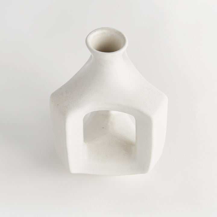 Short matte white clay vase, angled view showing the hollow center, rounded shoulders and smooth matte glaze. Modern Organic