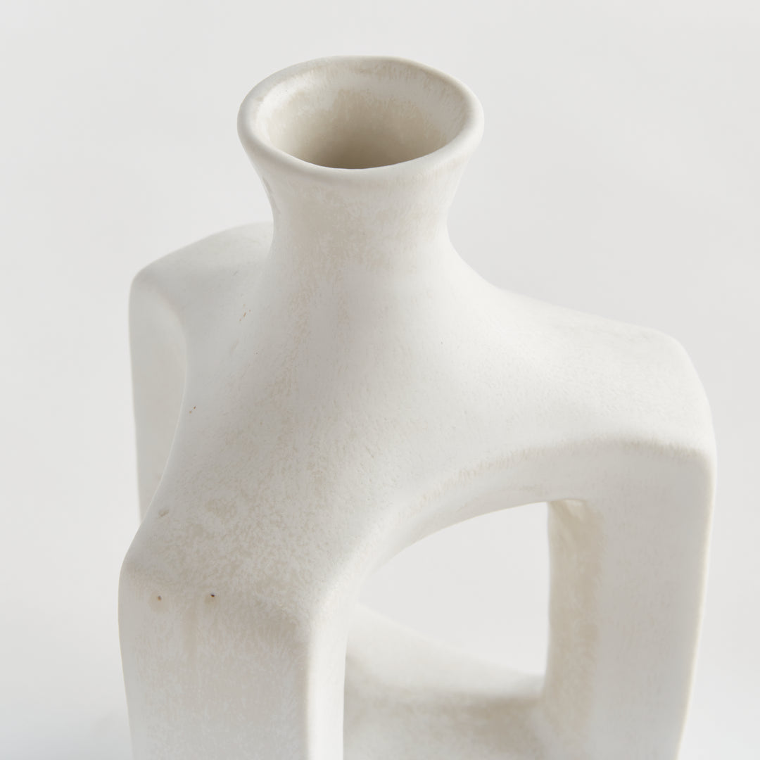 Short matte white clay vase, detail view showing softly curved edges, white glaze and the open central frame. Modern Organic