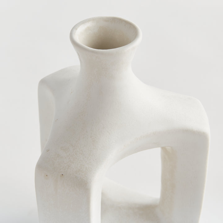 Short matte white clay vase, detail view showing softly curved edges, white glaze and the open central frame. Modern Organic