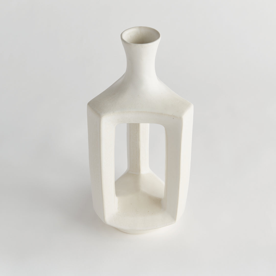 Tall matte white clay vase, angled view showing the hollow center, rounded shoulders and smooth matte glaze. Modern Organic