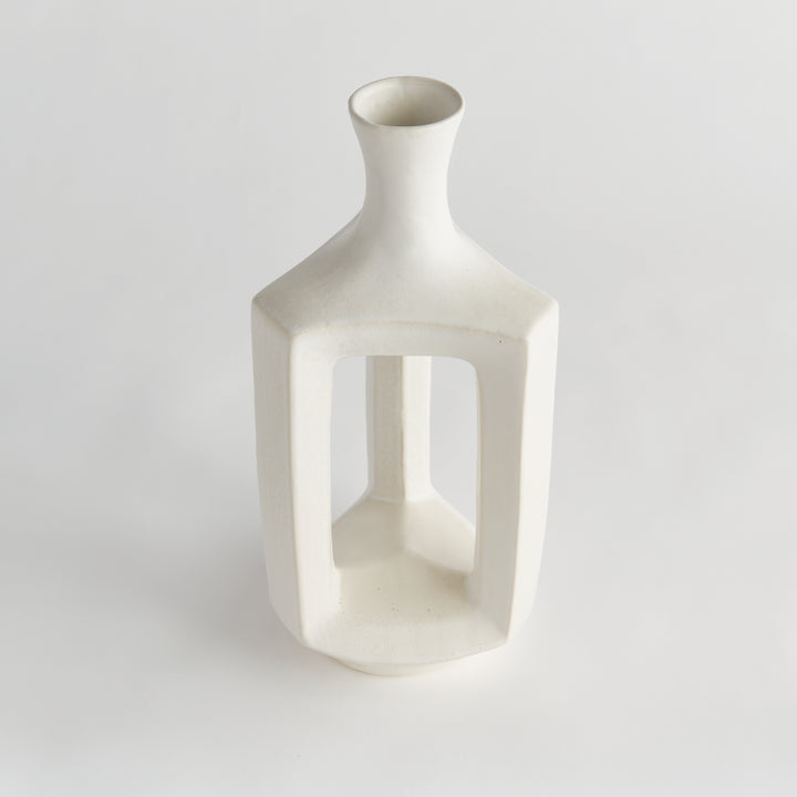 Tall matte white clay vase, angled view showing the hollow center, rounded shoulders and smooth matte glaze. Modern Organic