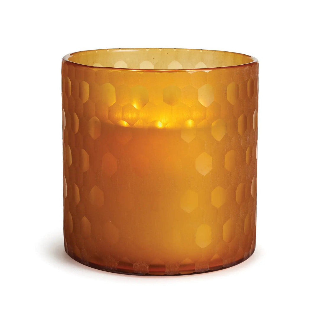 Amber glass hurricane candle holder with etched hexagon pattern and glowing LED effect, made from thick etched glass – Modern Glam.

