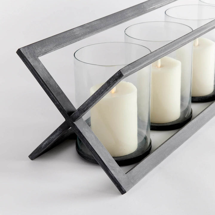 Angled black iron frame with five pillar candles in glass holders – Modern Industrial.