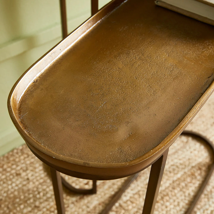 Antique brass console table tray top detail showing raised edge and textured metal surface modern transitional style