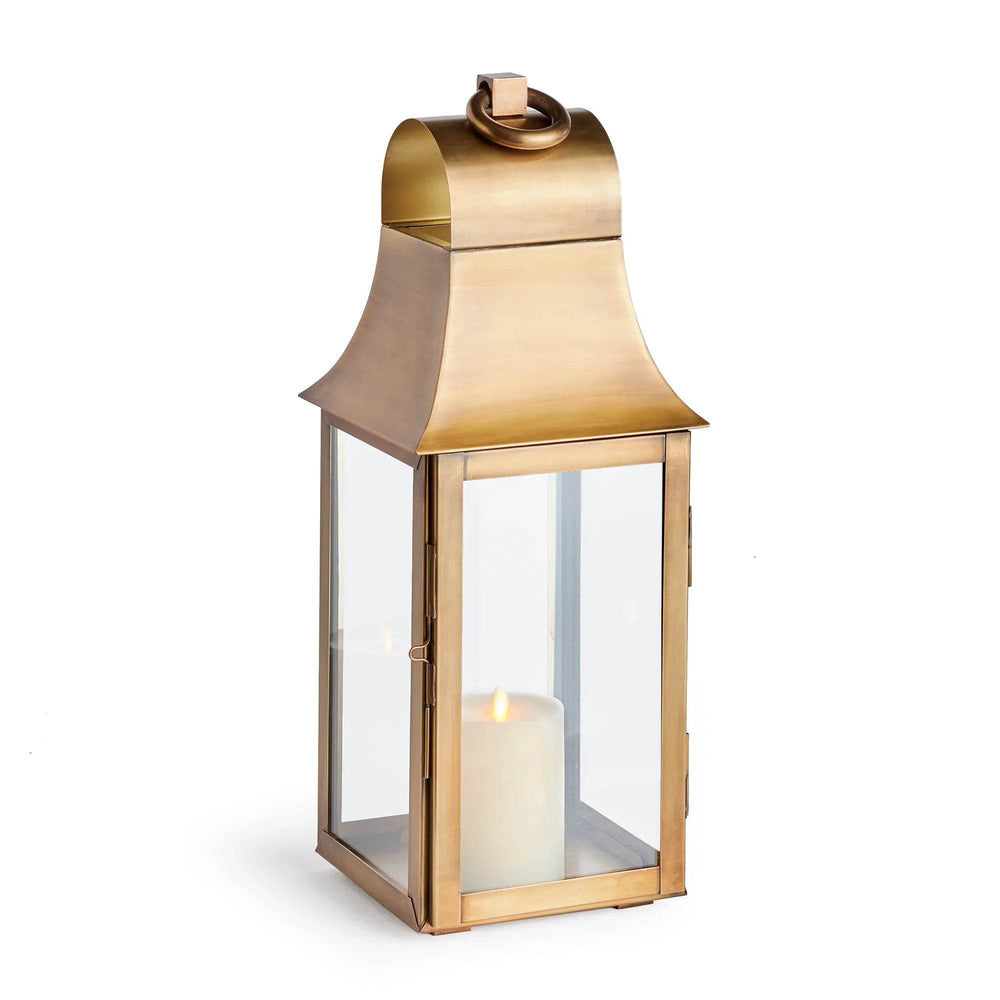 Tall decorative lantern with antique brass finish and glass panels, designed for indoor styling with flameless candle – Transitional Home Accent