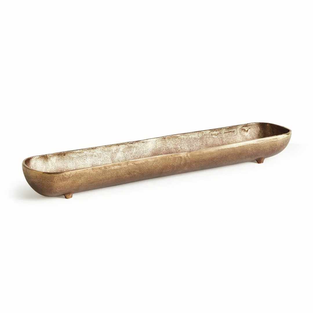 Long narrow decorative bowl in antique brass cast aluminum showing sculpted interior and organic form for table or console styling modern organic