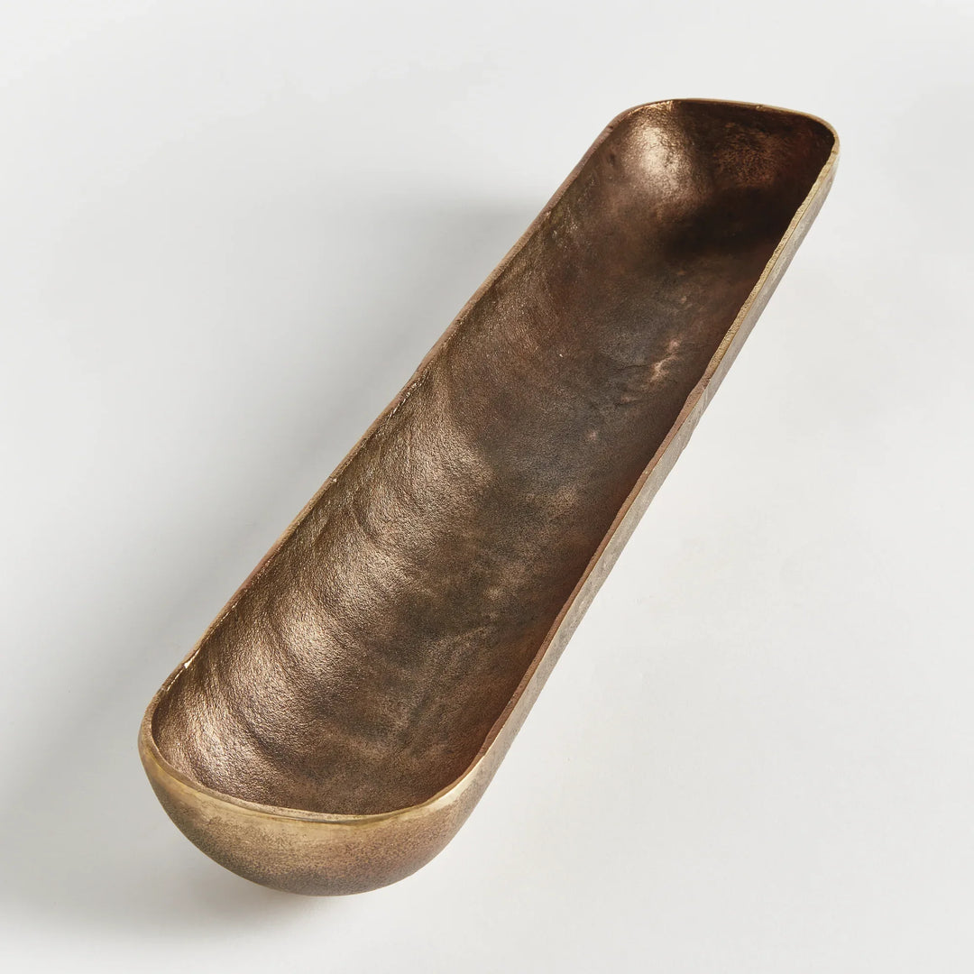 Antique brass narrow decorative bowl in cast aluminum with elongated form and textured finish styled as console accent modern organic