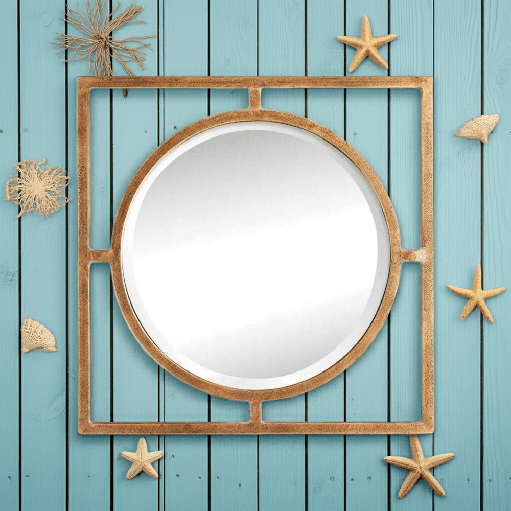 Antique gold 18 inch wall mirror with circular center, styled on blue panel wall with seashell accents, adding reflective detail to coastal décor – Traditional décor.