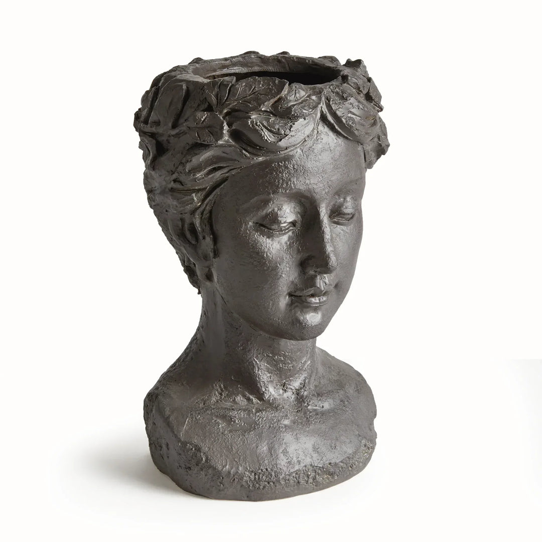 Antique black bust planter in concrete composite, with sculpted hair, classical facial detail and a round base. Transitional