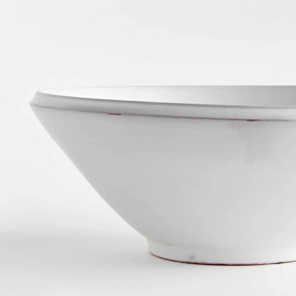 Close view of Aveline warm white terracotta bowl showing its curved rim, horizontal lines and tapered base. Modern Organic
