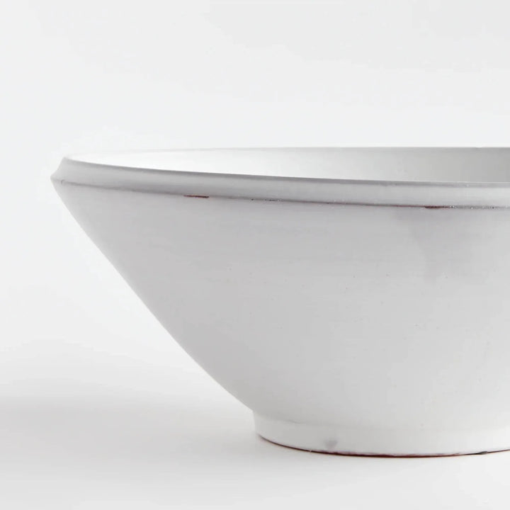 Close view of Aveline warm white terracotta bowl showing its curved rim, horizontal lines and tapered base. Modern Organic