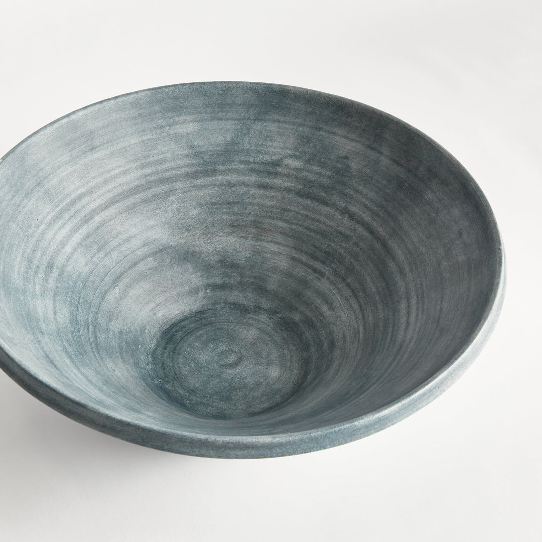 Overhead view of Aveline washed blue terracotta bowl showing throw lines and tonal glaze variation inside. Modern Organic