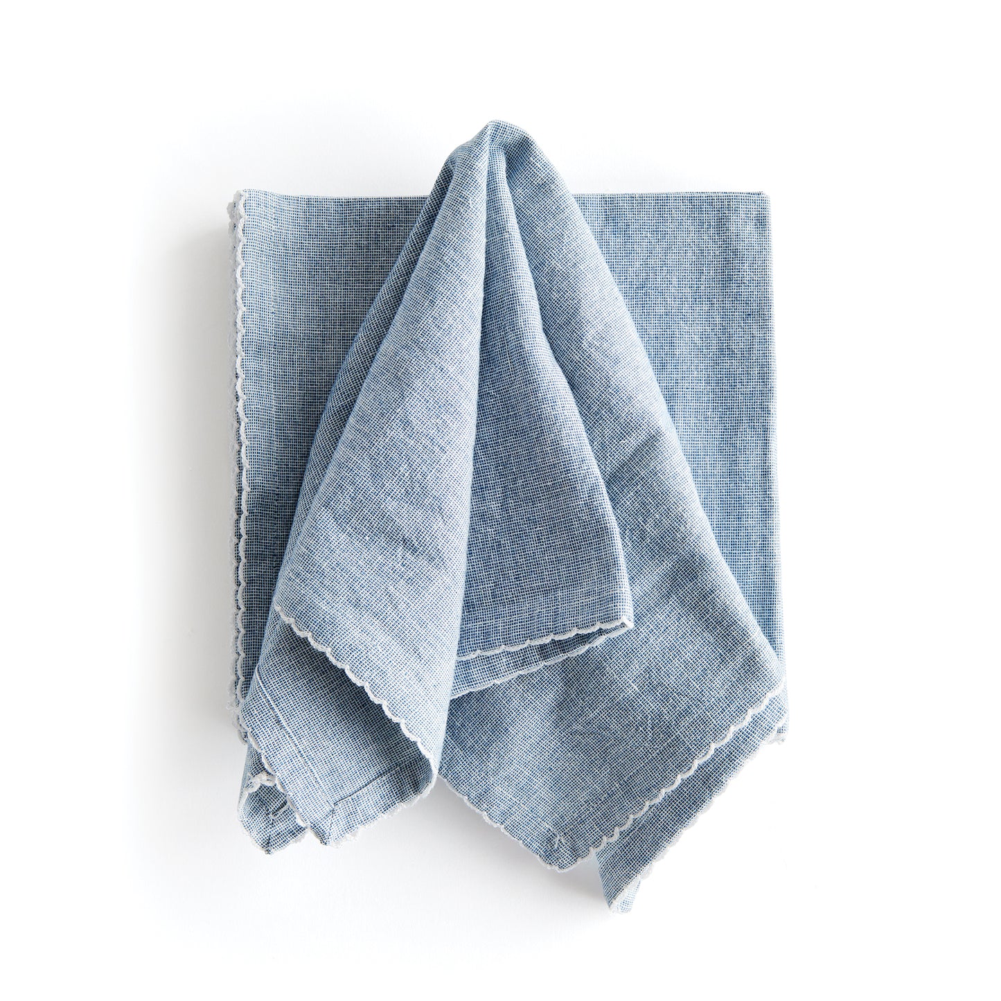 Bring a touch of softness to the table with this set of four cotton napkins. Beautiful in tone and texture, the rich blue is designed to add a pop of signature color to your tablescape.