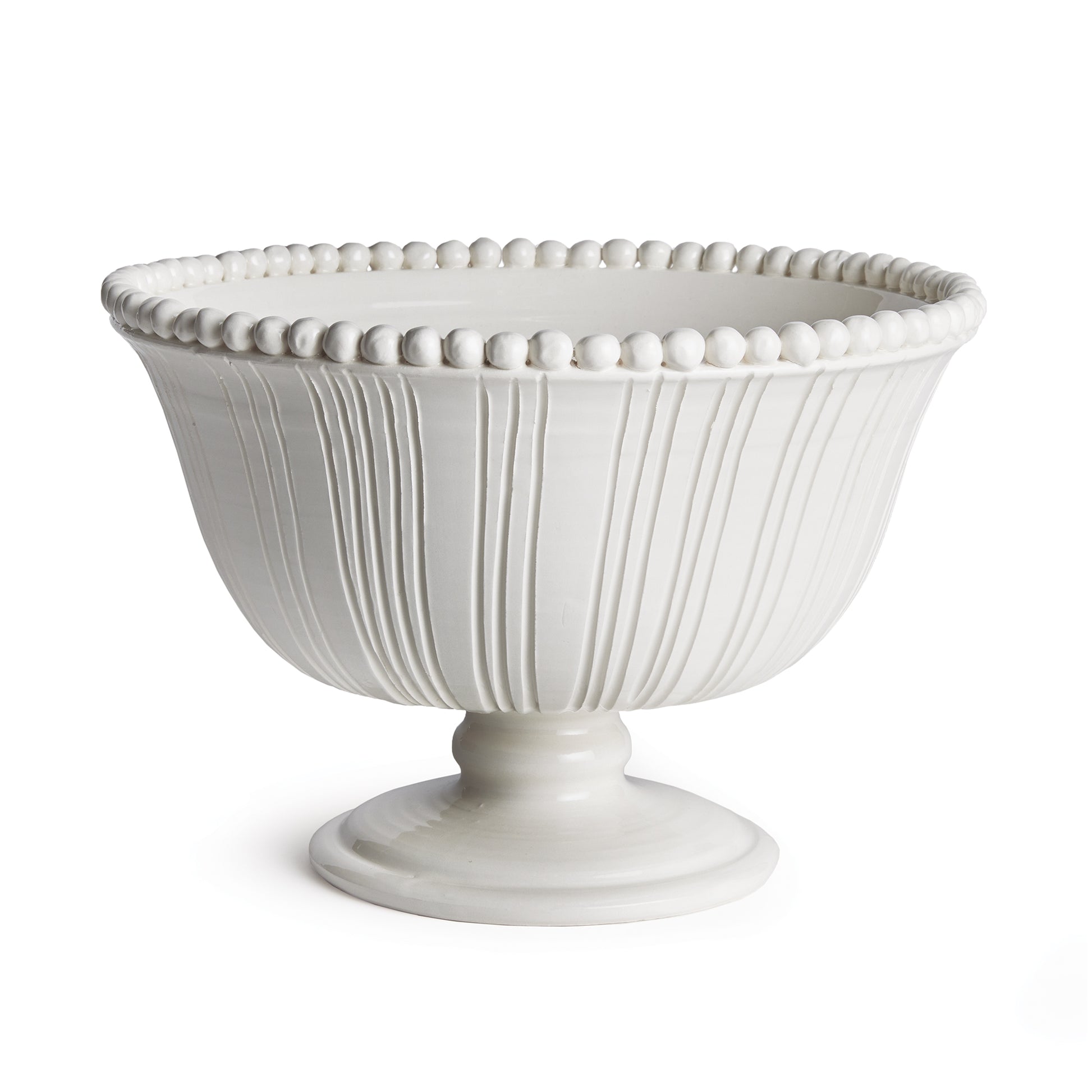 The Perla Decorative Footed Bowl is handmade by Italian artisans in Tuscany, Italy. The graceful ribbing and hand-applied beading are made with genuine attention to detail. With a classic Italian craftsmanship passed down through generations, each piece is a true original.