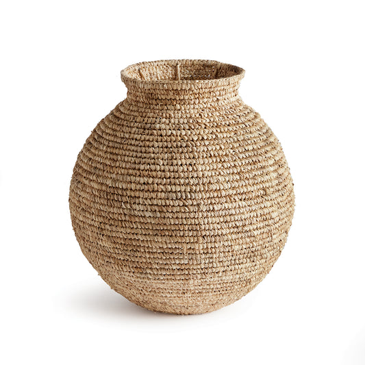 This traditional vase form takes on a fresh look. Made of a natural corn husk material tightly woven by skilled artisans. Add some faux stems or display as is for a simple way to add a warm, natural touch to your décor.