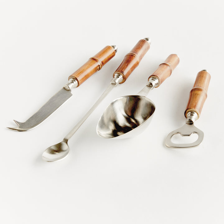 Angled top-down display of 4 stainless steel bar tools with bamboo handles in coastal casual style.