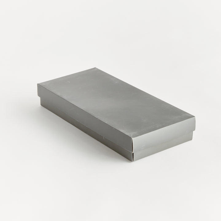 Closed gift box for bamboo barware set, shown in sleek gray packaging with coastal casual appeal.