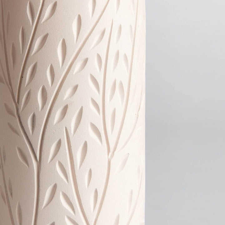 Top rim detail of handcrafted beige terracotta vine motif vase, showing smooth interior and matte finish.

