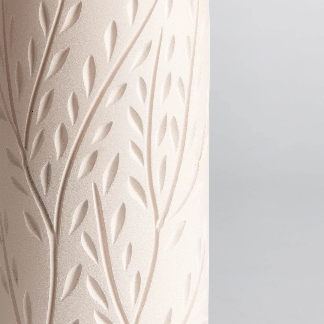 Top rim detail of handcrafted beige terracotta vine motif vase, showing smooth interior and matte finish.

