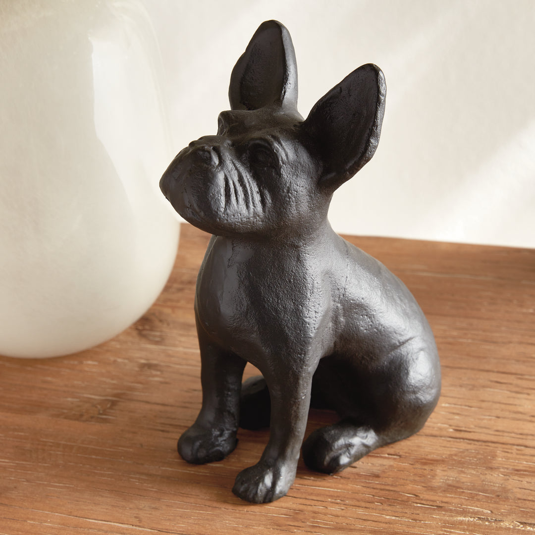 Front-left angle of sitting black aluminum dog sculpture, ideal for layered shelf styling or curated tabletop arrangements.