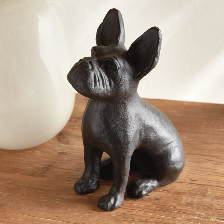 Front-left angle of sitting black aluminum dog sculpture, ideal for layered shelf styling or curated tabletop arrangements.