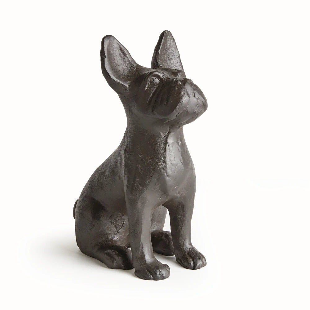 Side profile of black aluminum dog statue showing cast texture and upright ears, sculptural form with compact proportions.
