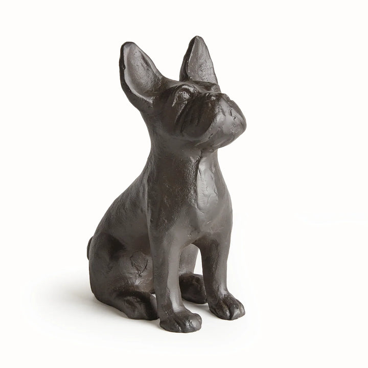 Side profile of black aluminum dog statue showing cast texture and upright ears, sculptural form with compact proportions.