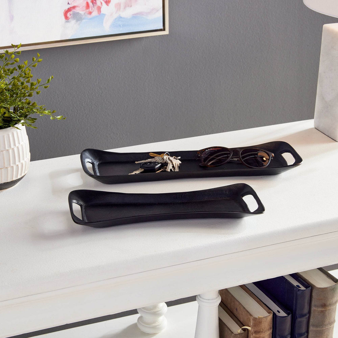 Black trays used on an entryway console, holding sunglasses and keys – Urban Contemporary.

