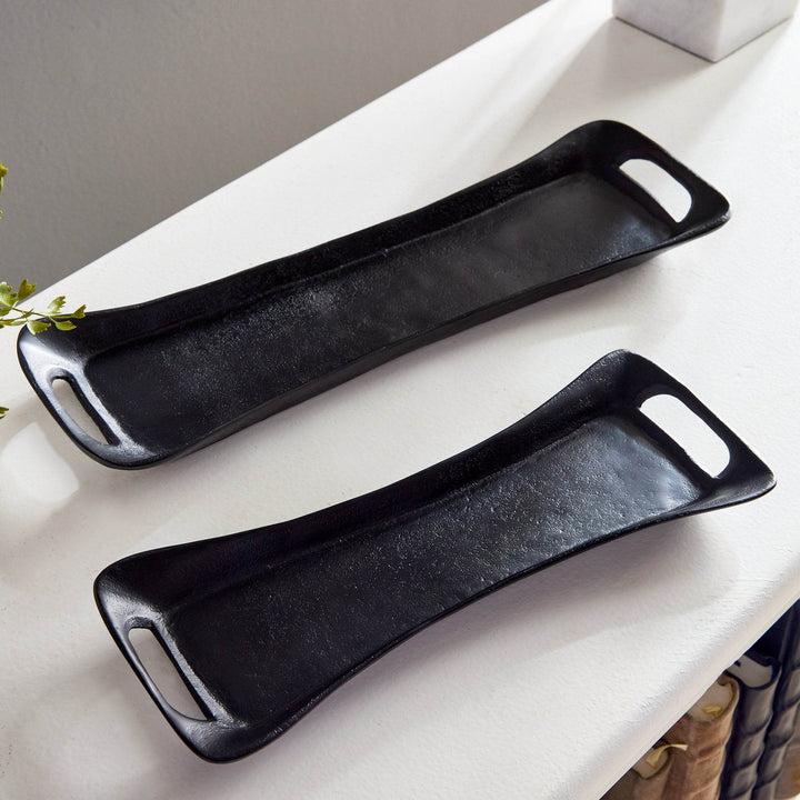 Close-up of modern trays showing wide cutout handles and curved shape – Urban Contemporary.

