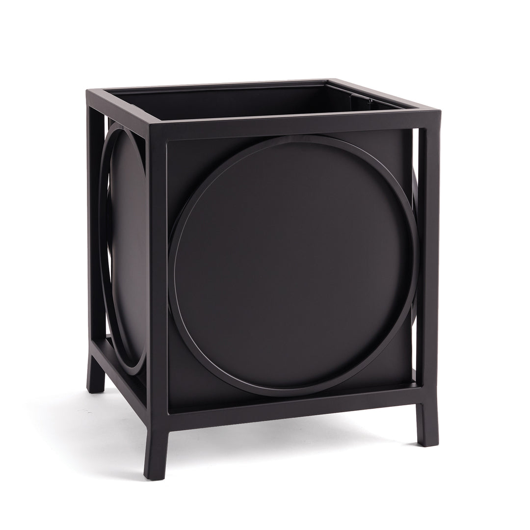 Black iron outdoor planter with bold circular detailing and squared frame, styled for architectural garden or porch settings.