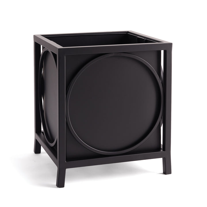 Black iron outdoor planter with bold circular detailing and squared frame, styled for architectural garden or porch settings.