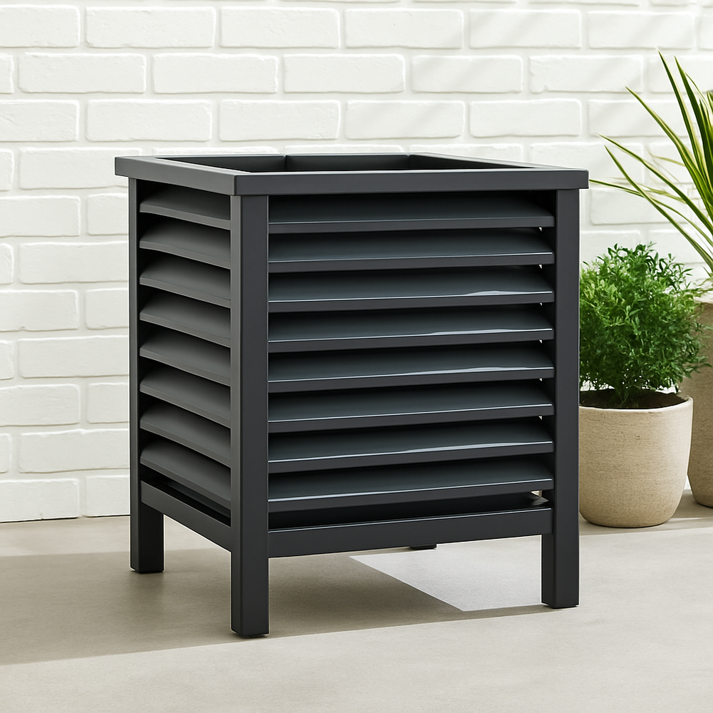 Side view of black iron planter with louvered panels and square frame in a modern industrial style setting.