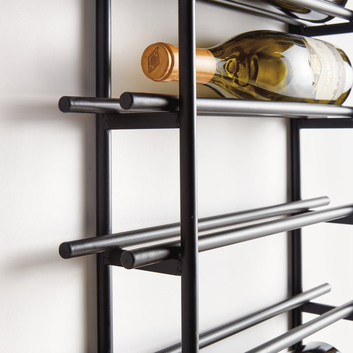 Close-up view of black iron vertical wall wine rack shelf with wine bottle resting securely in slim horizontal bars.