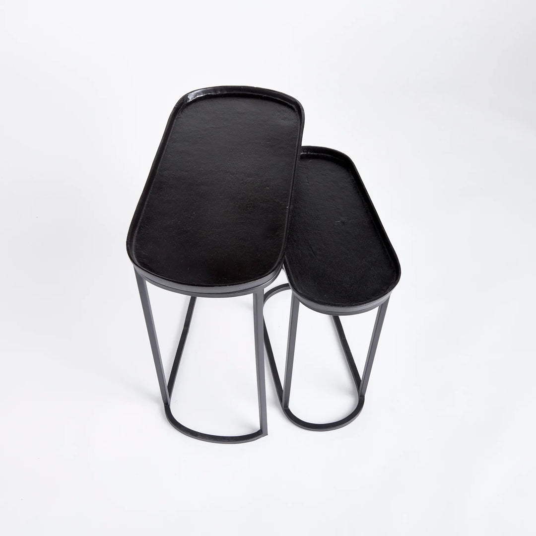 Black metal nesting end tables with tray tops shown at angle, slim modern side tables with space-saving design – Modern