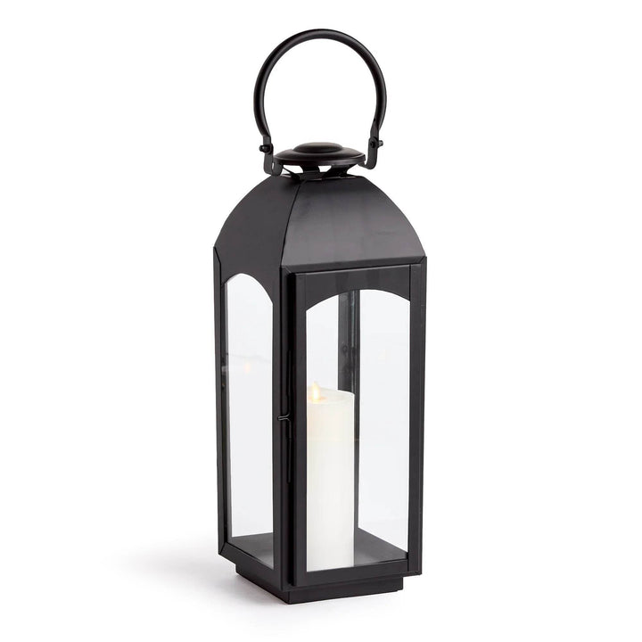 Large black outdoor lantern with glass sides, straight studio view on white; hinged door and latch visible – Transitional Style Decor