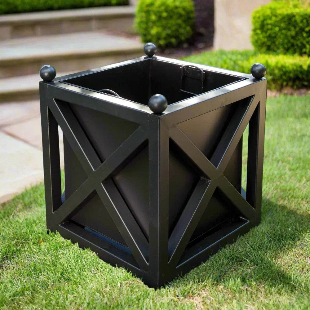 Black metal outdoor planter with cross-brace design shown on green lawn